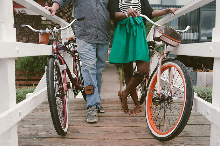 close-up of couple holding their bicycles next to each other