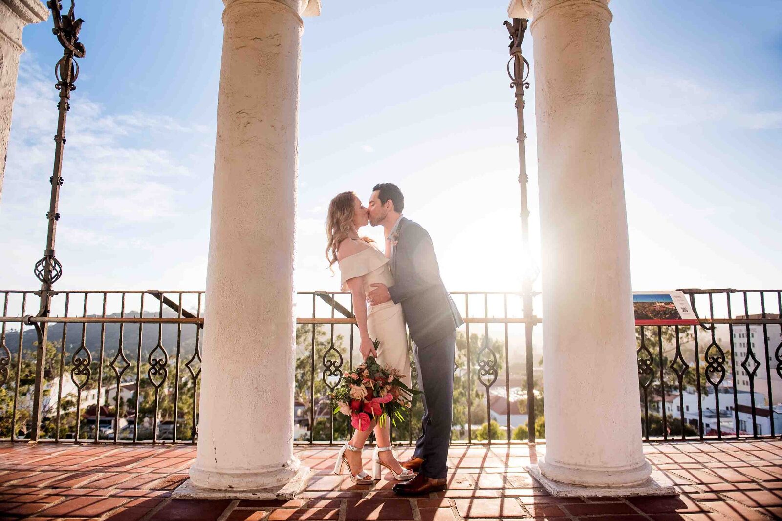 bride and groom kissing in the clock tower of santa barbara courthouse
