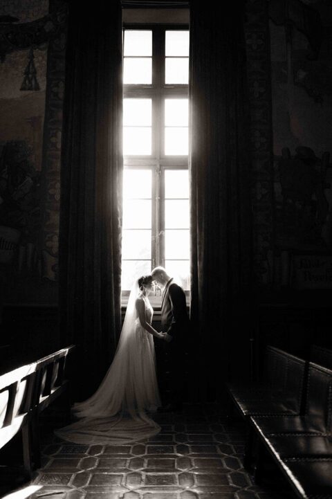 Bride and Groom kissing in the Mural Room of Santa Barbara Courthouse