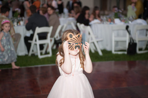 child wearing tiger mask at Santa Barbara zoo wedding