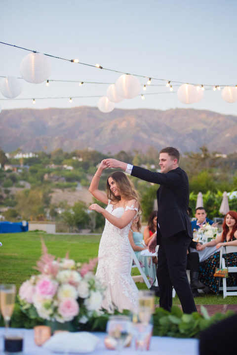 bride and groom first dance with mountain view at Santa Barbara zoo wedding
