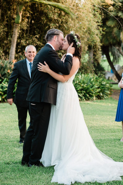 bride and groom kissing at their Santa Barbara Zoo wedding