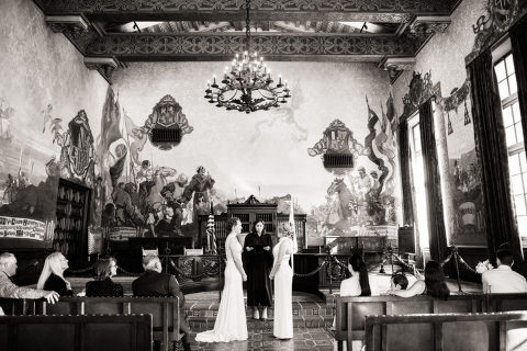 two brides getting married at the Santa Barbara courthouse Mural Room