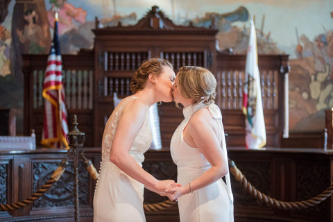 two brides getting married at the Santa Barbara courthouse Mural Room