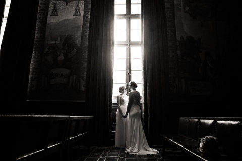 two brides at their Santa Barbara courthouse wedding in the Mural Room