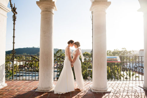 two brides at their Santa Barbara courthouse wedding in the clock tower