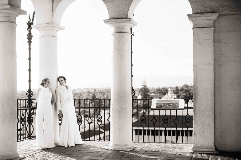Same sex couple looking at each other in the clock tower of the Santa Barbara Courthouse
