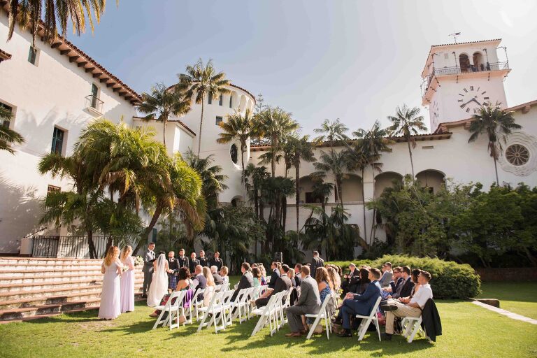 Wedding at the Fiesta Stage of santa barbara courthouse. Bride is one of the pilots of the historic all-female flyover of  Super Bowl LXII 62.